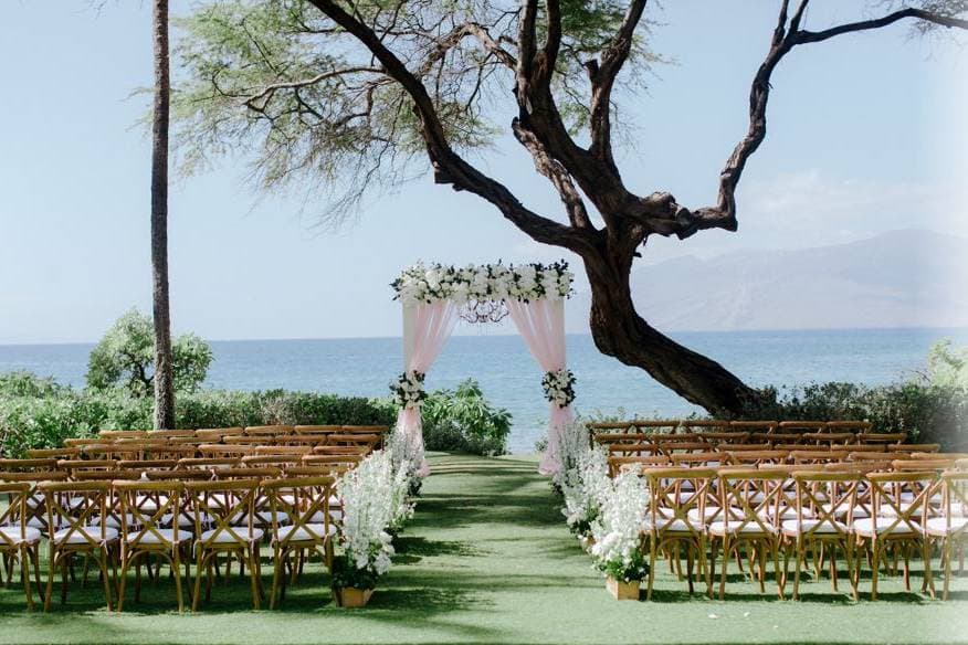 Photographer capturing a beachside wedding at Andaz Maui at Wailea Resort in Kihei, HI - Salt Drifter Photography.