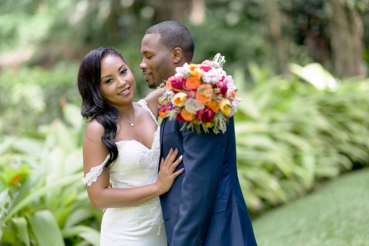 A photographer capturing the beauty of Haiku Gardens Weddings in Kaneohe, HI. Picture-perfect shots of the Ko'olau mountain range and lush greenery.