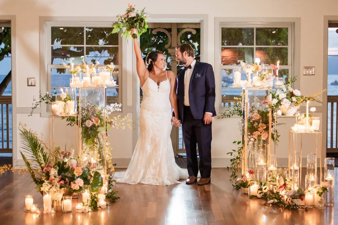 Photographer capturing stunning oceanfront wedding moments at Lahaina Loft venue in Maui, HI - Salt Drifter Photography.