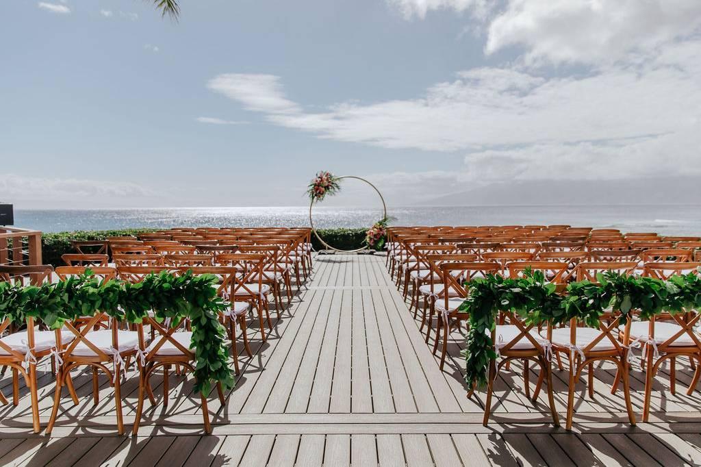 Photographer capturing wedding at Merriman's Kapalua Maui in Lahaina, HI - Salt Drifter Photography