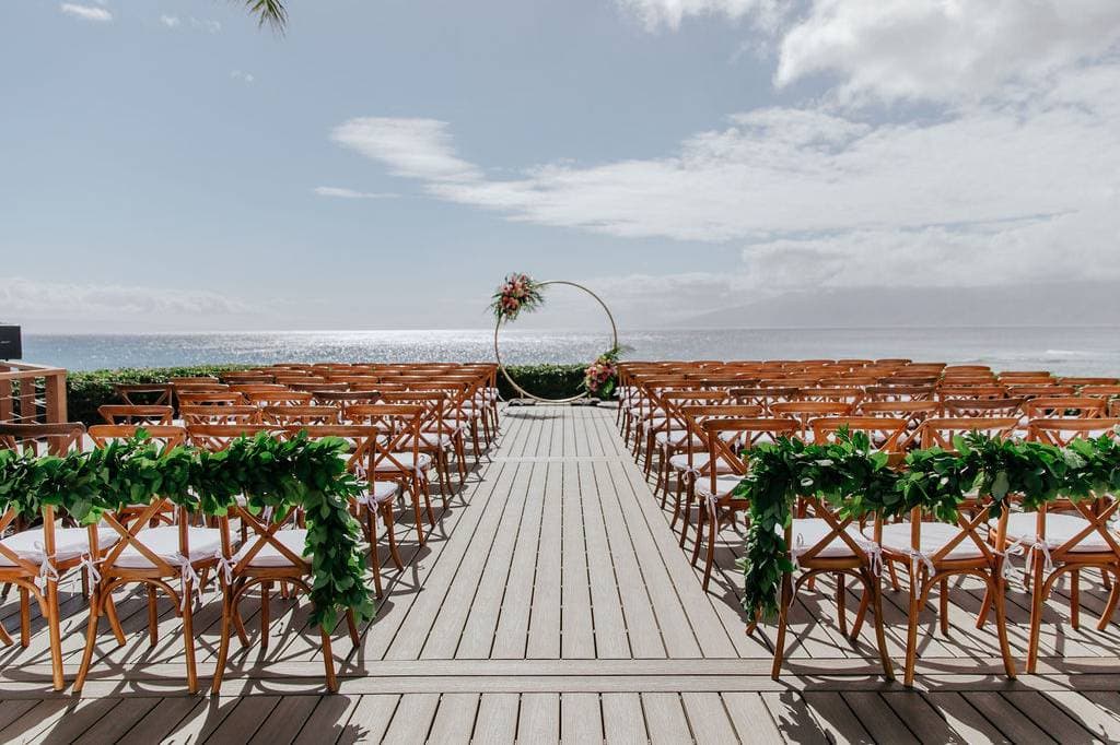 Photographer capturing wedding at Merriman's Kapalua Maui in Lahaina, HI - Salt Drifter Photography