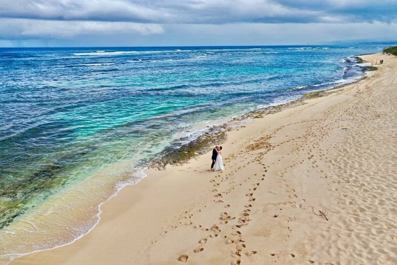 Photographer at Owen's Retreat in Waialua, HI - Salt Drifter Photography offers stunning wedding photos capturing the beauty of your special day.