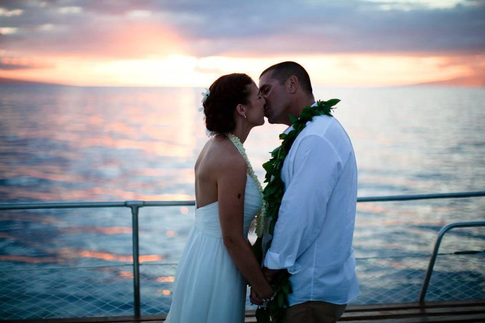 Photographer capturing beautiful moments for weddings in Lahaina, HI aboard catamarans - Salt Drifter Photography by maui.