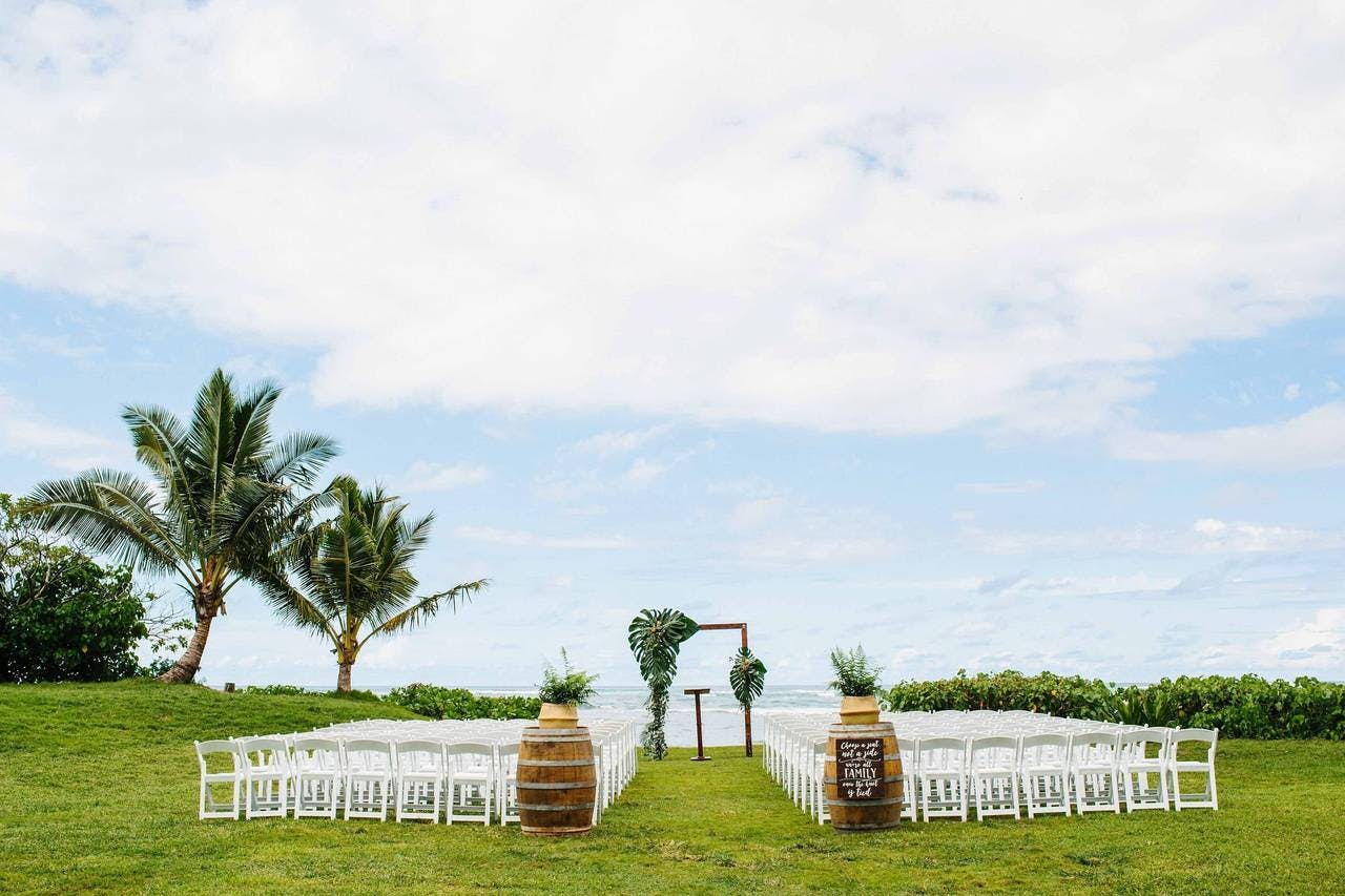 Photographer capturing the beauty of Loulu Palm Weddings in Haleiwa, HI. Salt Drifter Photography showcases unforgettable moments in this ethereal beachside farm.